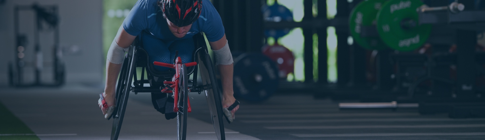 A disabled man doing exercises in his sport wheelchair.